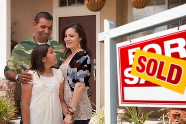 hispanic family with sold sign1.1.jpg
