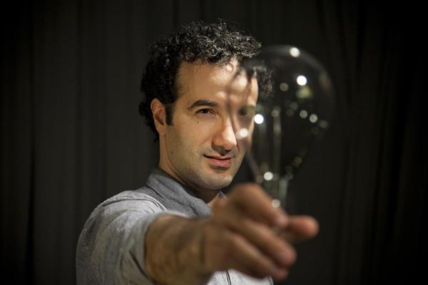 Jad Abumrad-with light bulb (credit Marco Antonio)
