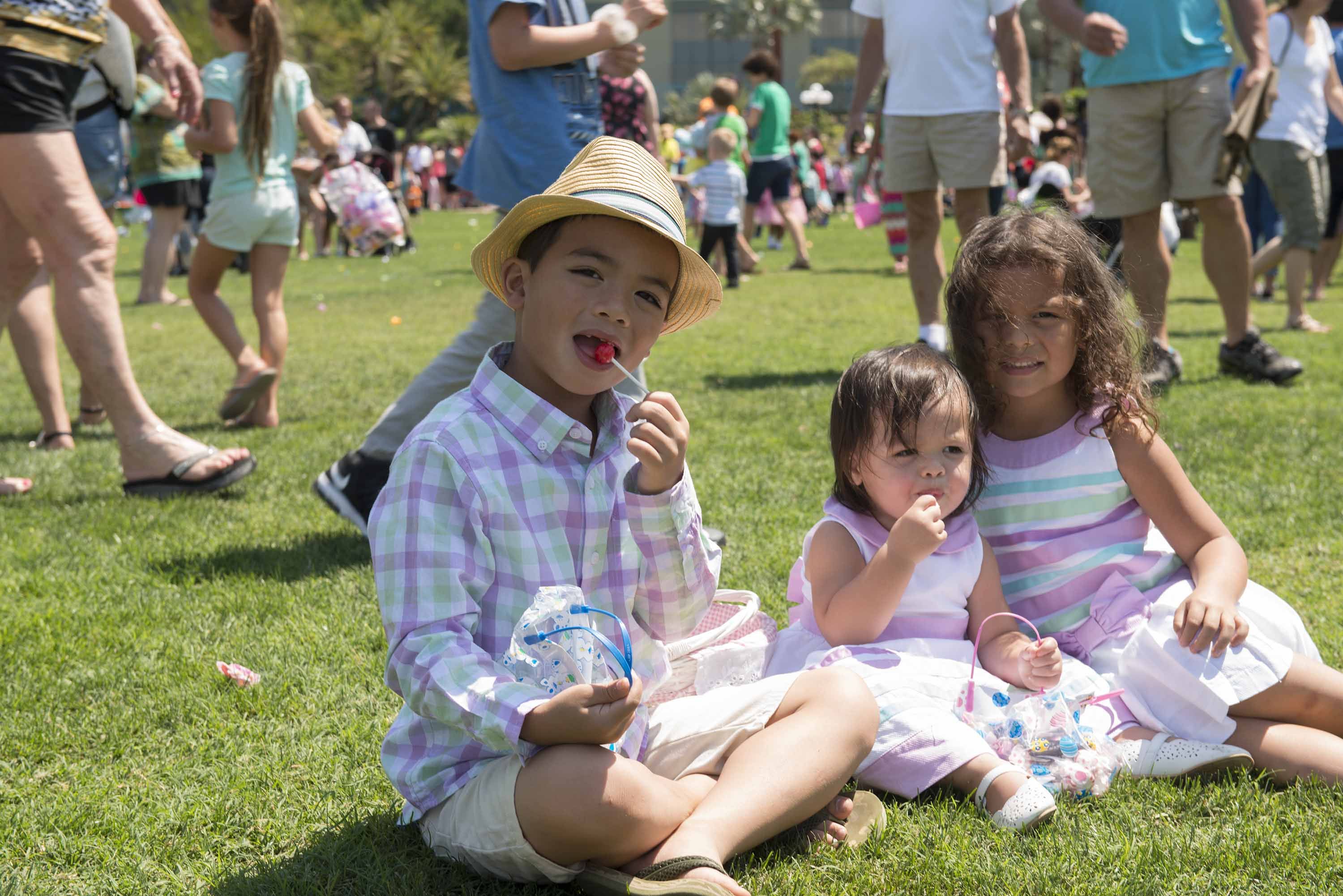 SIBLINGS TRY OUT THEIR CANDY LOOT AT SCIENTOLOGY'S EASTER EGG HUNT