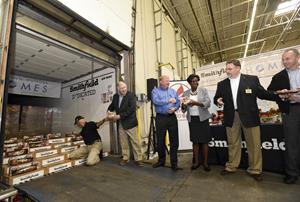 Representatives unload a portion of Smithfield’s 25,000-pound Helping Hungry Homes donation.