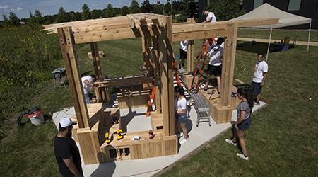 College of DuPage Architecture students and program alumni spent several weeks formalizing the design with clients before beginning fabrication and installation of a structure near the campus community garden.