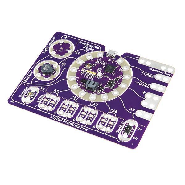 The LilyPad ProtoSnap Plus features multiple LilyPad components including the LilyPad USB Plus, a light sensor, buzzer, button board, four pairs of colored LEDs, and a slide switch. The board represents the latest iteration of sewable electronics technology.