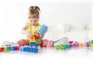 Little Girl playing with Megs blocks