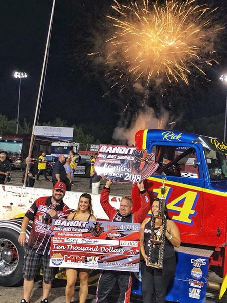 Ricky ‘Rude’ Proffitt celebrates his Bandit Series feature win with a $10,000 check at Hickory Motor Speedway on August 11th.