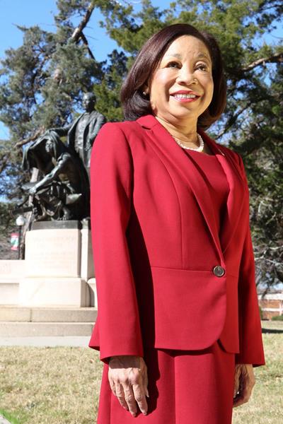 Tuskegee University President Lily D. McNair, pictured in front of the university's Booker T. Washington Monument, also referred to as the Lifting the Veil Monument.