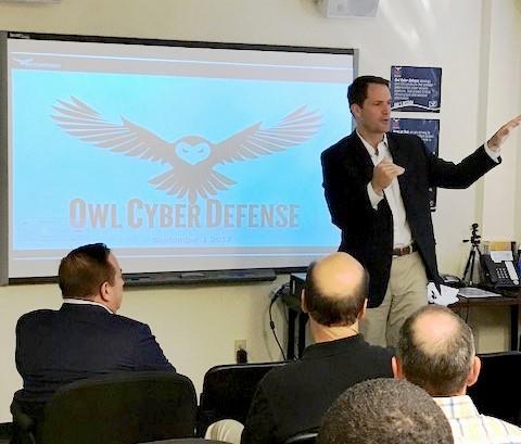 Rep. Jim Himes speaks with staff at Owl Cyber Defense Solutions