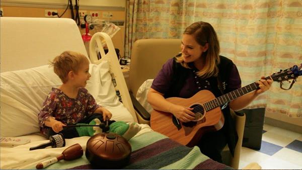 Theo performs from his hospital bed with a MyMusicRx in-hospital specialist for Bedstock.