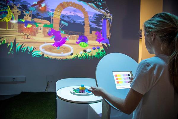 A young girl customizes her creation in Animaker, a new AI exhibit opening at The Tech Museum of Innovation in San Jose June 15.  This is the first experience in the world where children play and learn about AI by training machines to recognize different interpretations of real world objects. Photo by Nick Leoni