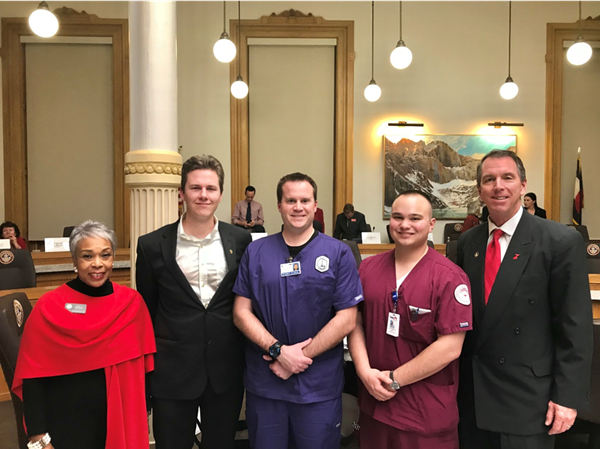 CCCS nursing students stand proudly with HB 18-1086 sponsors. Left to right: Rep. Buckner; Alan Favier, Front Range Community College; Jason Lalonde, Arapahoe Community College; Matthew Muramoto, Pueblo Community College; Rep. Lundeen.