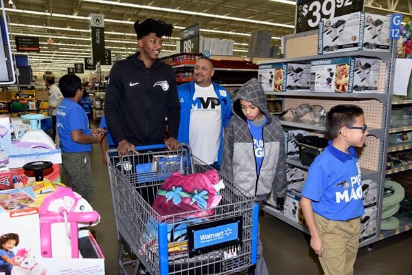 Magic player Elfrid Payton spends time with Boys & Girls Club youth at the Magic and PepsiCo. Holiday Shopping Spree on Dec. 12.

(All photos taken by Gary Bassing, Orlando Magic)