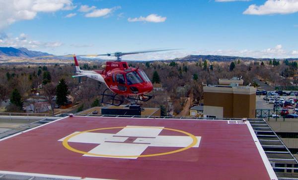 The UCHealth Lifeline helicopter is shown atop UCHealth Memorial Hospital Central in Colorado Springs, Colo. 