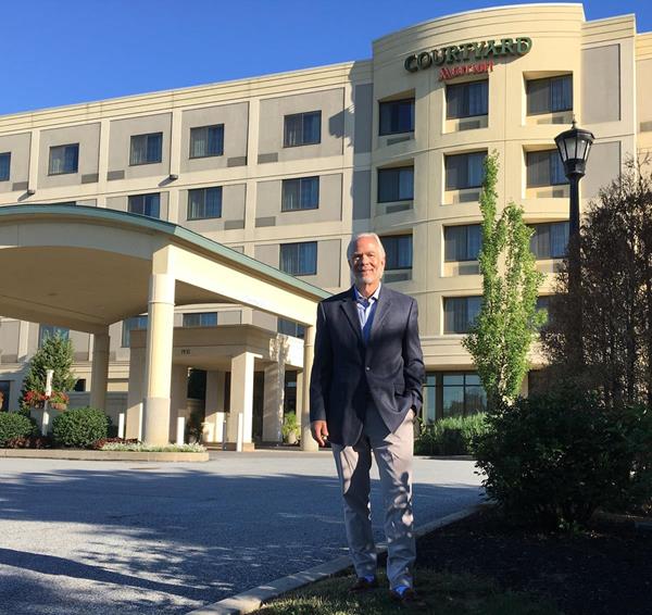Russ Urban, president of High Hotels Ltd., stands at the Courtyard by Marriott in Lancaster, Pa, the first Marriott-branded hotel in the U.S. with 100 percent of its electricity needs generated from solar power. 