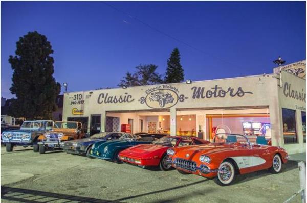 Garage 77 in Los Angeles with a lineup of classic cars on display.