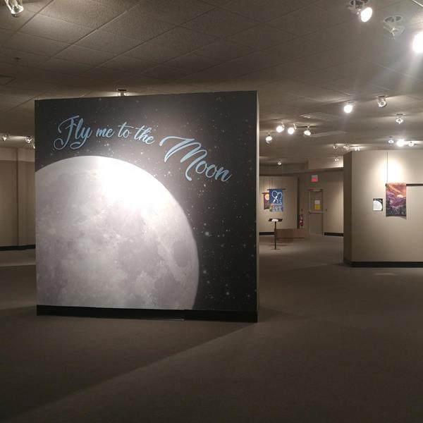 Picture of Fly Me to the Moon exhibit in The National Quilt Museum gallery.