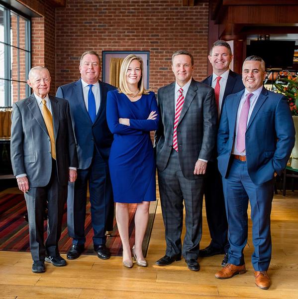 HITT CEO Kim Roy and Co-Presidents Jeremy Bardin and Drew Mucci stand alongside company owners and Board Co-Chairmen Jim Millar and Brett Hitt, and Chairman Emeritus Russell Hitt . 