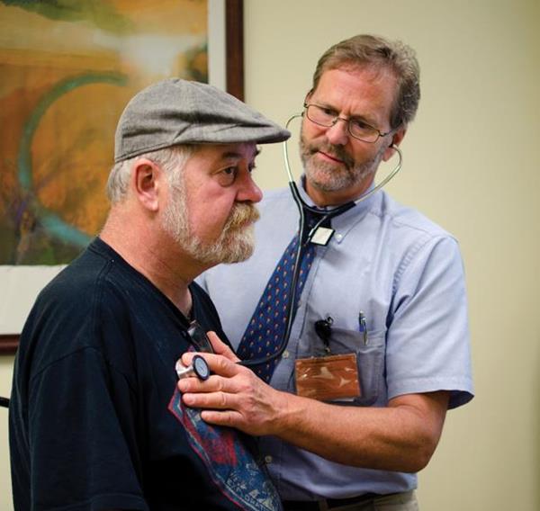 Dr. Steve Crane with a patient at The Free Clinic in Hendersonville, North Carolina.