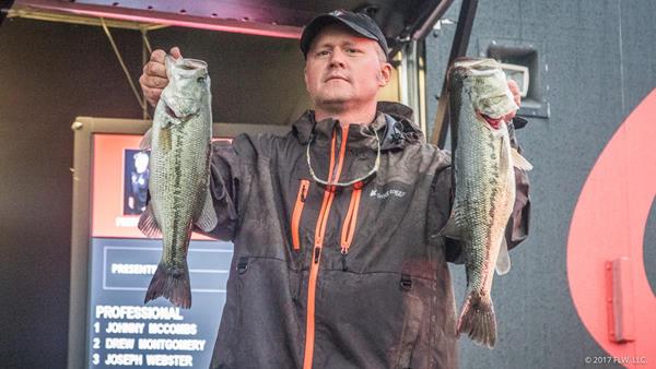 After starting the day in 11th place, pro Johnny McCombs of Morris, Alabama, battled through the storms and brought a five-bass limit to the scale weighing 18 pounds, 15 ounces – the heaviest limit of the tournament and seventh largest at Beaver Lake in FLW Tour history – to vault to the top of the leaderboard on Day Three of the FLW Tour at Beaver Lake. (Sean Ostruszka/FLW)