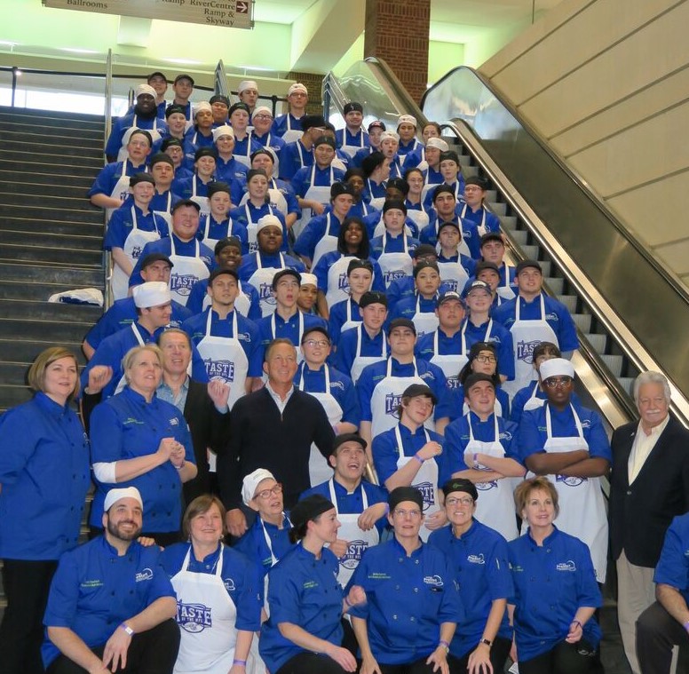 ProStart students in Minnesota pose for a group photo with chefs from across the country, representing each of the 32 NFL teams for Taste of the NFL, a fundraiser held the night before the Super Bowl to stop hunger.