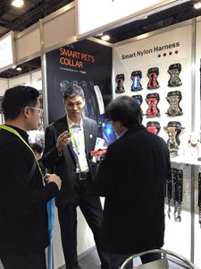 Staff demonstrating the Dogness H2 Smart Harness at CES 2018