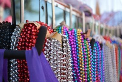 Krewes line their floats with beads and throws in preparation for one of three parades in Pensacola. 