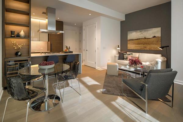 Furnished Quarters temporary apartment at One Hudson Yards — living room and kitchen. 