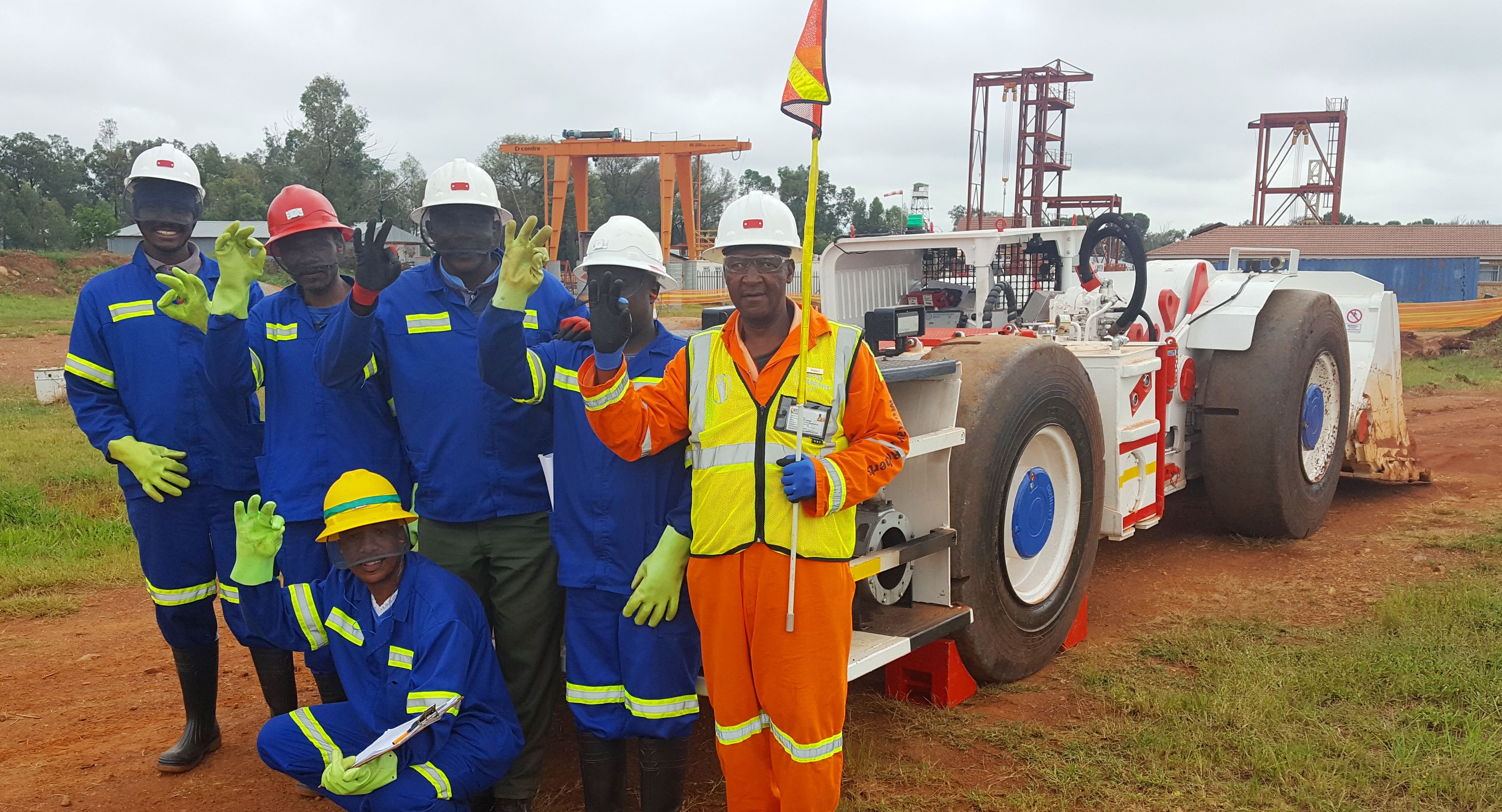 Trainee operators from the local Mokopane community with Platreef’s new  5.5-tonne, load-haul-dump machine (LHD). 