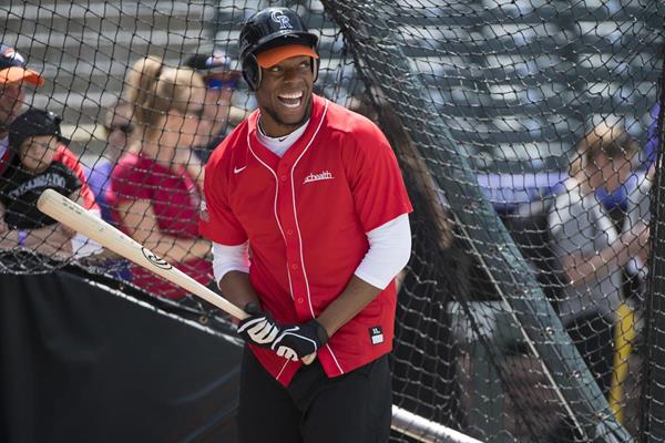 Denver Broncos linebacker Brandon Marshall steps up to the plate to hit baseballs for the UCHealth Healthy Swings: Charity Home Run Derby at Coors Field in Denver on May 11, 2018.