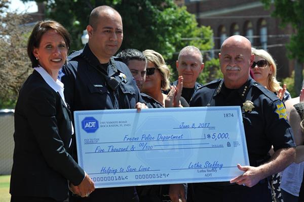 ADT presents contribution to Fresno Police Department
