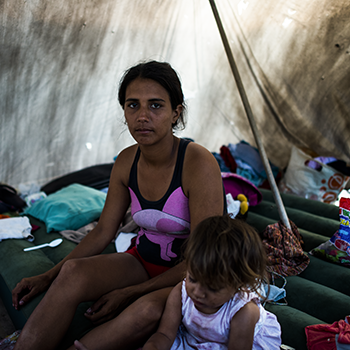 A Venezuelan woman and her daughter take shelter in a Colombian border town. Three million people are expected to flee Venezuela by next year.  
