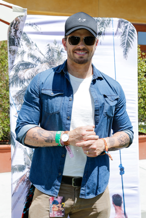 Twilight star Kellan Lutz showing off his new Daniel Wellington watch at the GBK and Art Naturals Influencer and Celebrity Gifting Lounge during Coachella Weekend One. 