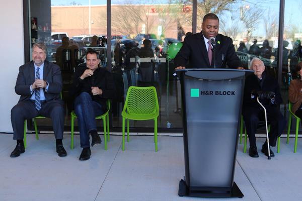 H&R Block and The Roasterie Café celebrate their collaboration on Main Street with a ribbon cutting ceremony November 30, 2017.
