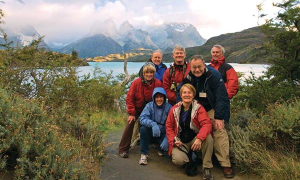 International Expeditions' Patagonia tour guests stop for a group picture in Torres del Paine National Park. 