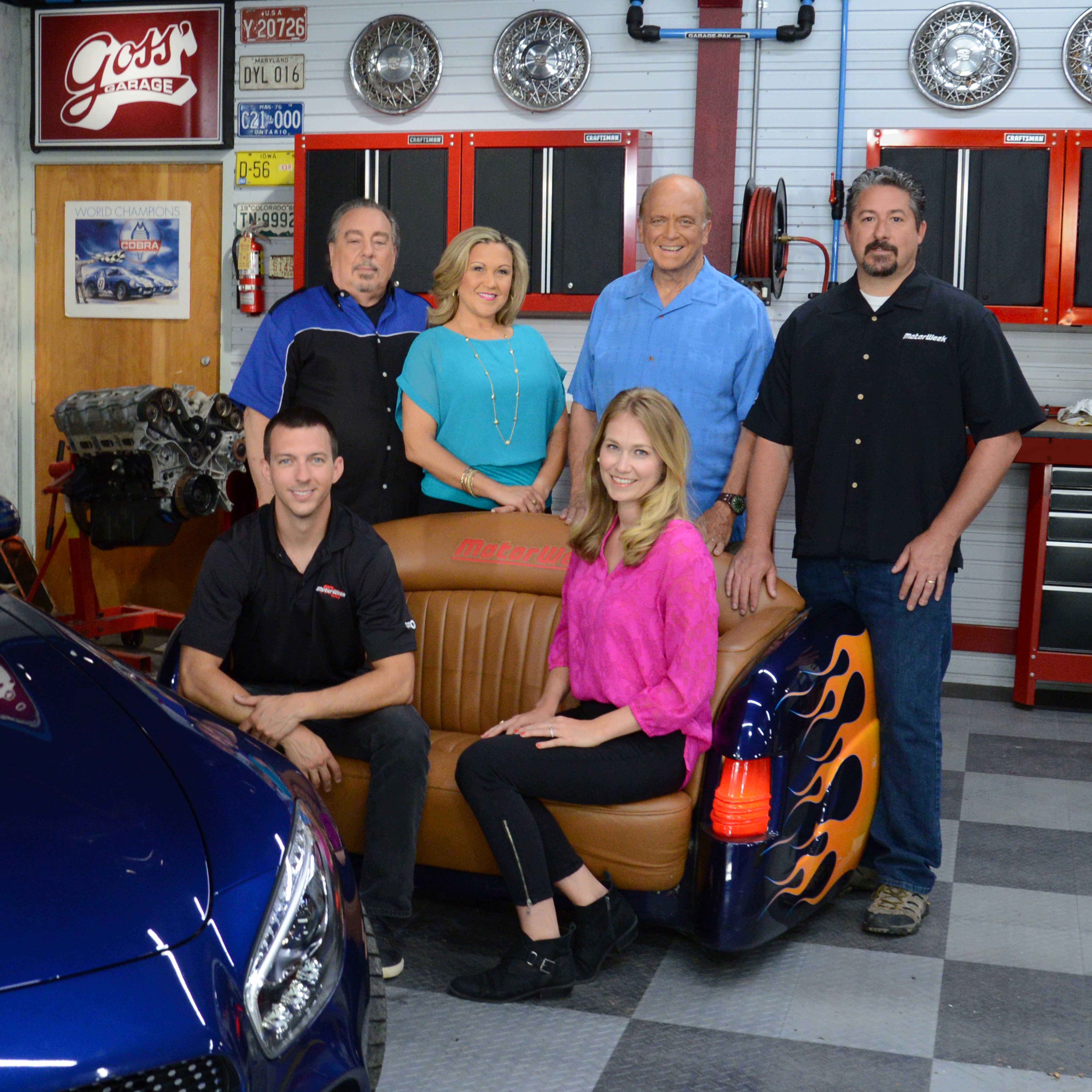 The MotorWeek team takes a break on the series set. Pictured left to right are (sitting) Zach Maskell, Lauren Morrison, (standing) Pat Goss, Yolanda Vazquez, series host John Davis, and Brian Robinson.