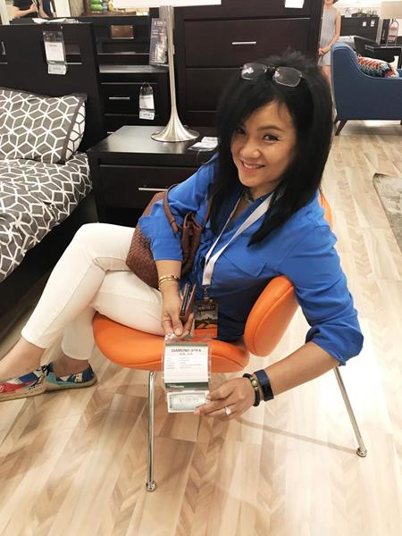 CEO Tawny Lam Relaxing on a Diamond Sofa Brand Roxy Chair