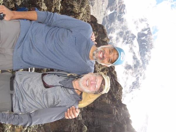 Malcolm Bilimoria, M.D., left, and his patient Ken Brown, right, hiked Mount Kilimanjaro together to celebrate Ken's cancer-free status. 