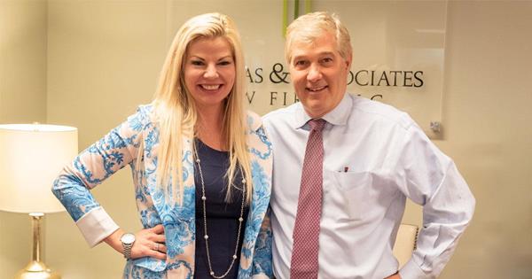 Nancy Fitzgerald, President & CEO of iLendingDIRECT, and Douglas Thomas, Founder & Managing Partner of Divorce Matters, pose for a photo together to celebrate the new partnership of the two companies.