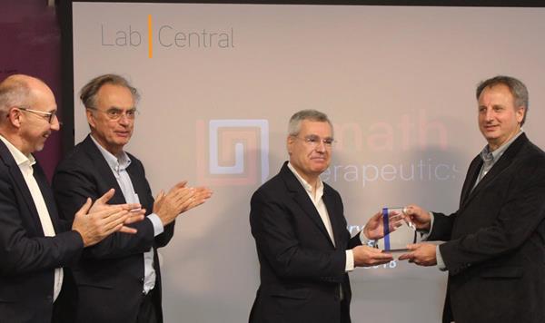 From left to right: R&D General Manager Claude Bertrand, Ph.D.,  Senior Executive Vice-President R&D Emmanuel Canet,M.S., Ph.D., and President of Servier Olivier Laureau, presenting the 2018 LabCentral Golden Ticket, sponsored by Servier to Edward Holson, Ph.D., chief scientific officer of Amathus Therapeutics at LabCentral in Kendall Square, Cambridge, Massachusetts, on October 5, 2018. LabCentral is the premier shared laboratory workspace for high-potential life science startups in Greater Boston. Since LabCentral opened in late 2013, it has demonstrated that launching a company in its supportive ecosystem increases the probability of success: LabCentral startups can focus resources on meeting science & business milestones, with potential of 10-20x less capital investment than building out/operating their own dedicated wet lab/office facilities and its startups and graduates have raised more than $2.5 billion in VC and other funding.