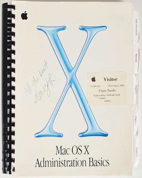 In 2001, Steve Jobs signed this Mac technical manual for a fan in the Apple Inc. parking lot in Cupertino, Calif. 