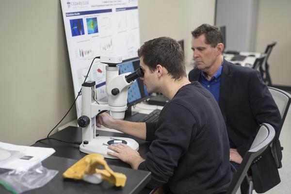 Mitchell Ryan studies human tissue scaffolds in a Cedarville University laboratory with Dr. Tim Norman, professor of mechanical and biomedical engineering. (Photo by Scott Huck)
