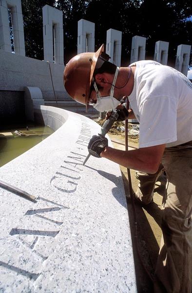 Nick Benson carves inscriptions for the National World War II Memorial in Washington, DC. Photo by Richard Latoff, courtesy Nick Benson.
