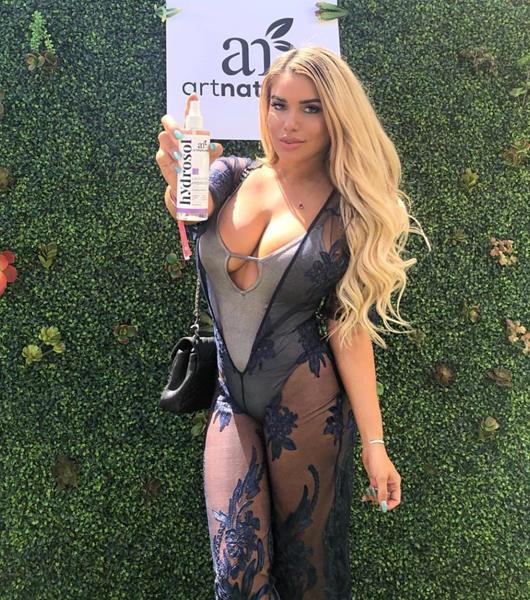 Chantel Zales loving the Art Naturals Rose Hydrosol Spray at the GBK and Art Naturals Influencer and Celebrity Gifting Lounge at Miramonte Resort during Coachella Weekend One. 