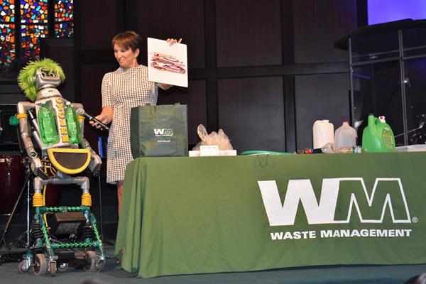 Waste Management Director of Communications Dawn McCormick and Cycler, the recycling robot, share some recycling do’s and don’ts with students at Highlands Christian Academy in Pompano Beach. The presentation was part of Waste Management’s $5 million donation to Step Up For Students, who administers the Florida Tax Credit Scholarship Program allowing families to send their child to a school which best meets their learning needs. 