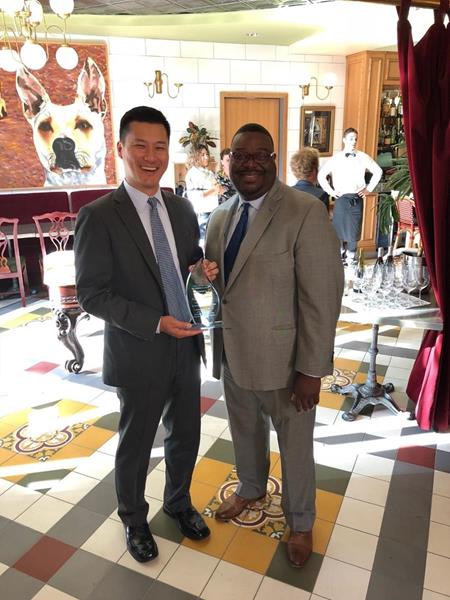 Thomas Lawson, President of the California Natural Gas Vehicle Coalition, presenting the NGV Innovator of the Year award to Seung Baik, Chief Legal Officer of Agility Fuel Solutions