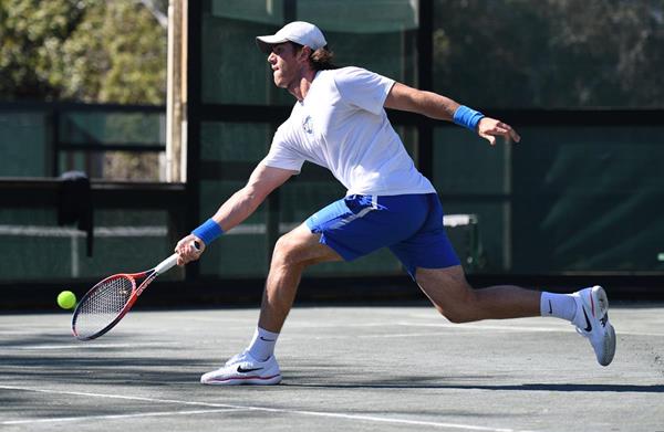 Tournament tennis player competing in a match on the Rubico courts at Hidden Dunes Beach & Tennis Resort in Miramar Beach, Florida