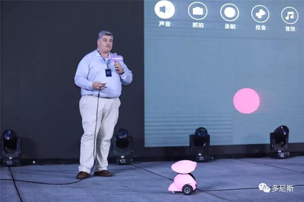 Mr George Taylor, Sales and Marketing Director, demonstrates the Dogness Smart iPet Robot on stage at the product launch event