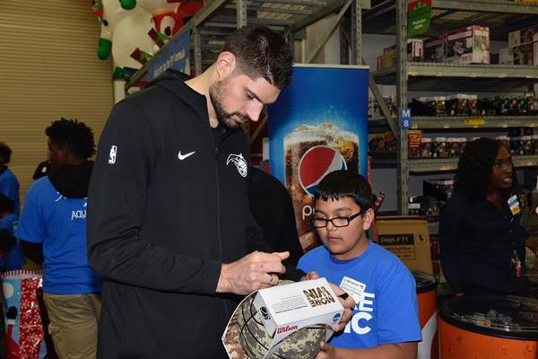 Magic player Nikola Vucevic spends time with Boys & Girls Club youth at the Magic and PepsiCo. Holiday Shopping Spree on Dec. 12.

(All photos taken by Gary Bassing, Orlando Magic)