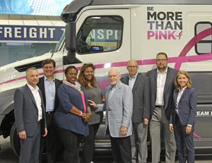 Werner Enterprises and Daimler Trucks North America present the Susan G. Komen Race for the Cure truck to professional drivers Dorwenda and Sanaye Lewis.