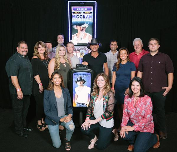 Photo Advisory: Tim McGraw poses in front of Aristocrat’s new Tim McGraw™ Slot Game in Las Vegas on July 13