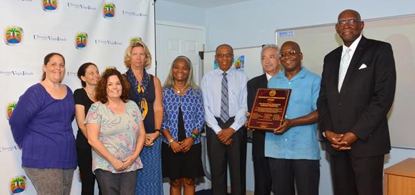 UVI President David Hall presents Presidential Appreciation Award to the accreditation Self-Study Initiative Steering Committee members: Julie A Cruz, Laurie Blake, Tracy Bray, Tina M. Koopmans, Dr. Noreen Michael, Dr. Frank Mills, Allen Bray and Dr. Lonnie Hudspeth. 