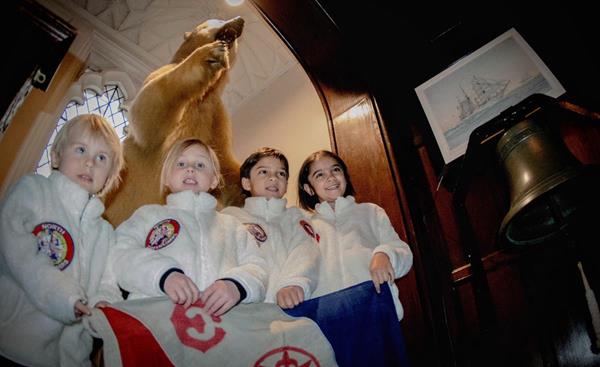 L to R, Ronin Phi Garriott de Cayeux (age 3), Kinga Shuilong Garriott de Cayeux (age 5), Olivier Ren Kraus (age 7) and Maika Ai Kraus (age 7) are presented with Explorers Club Flag #61 which they will take with them on their expedition to the North Pole.